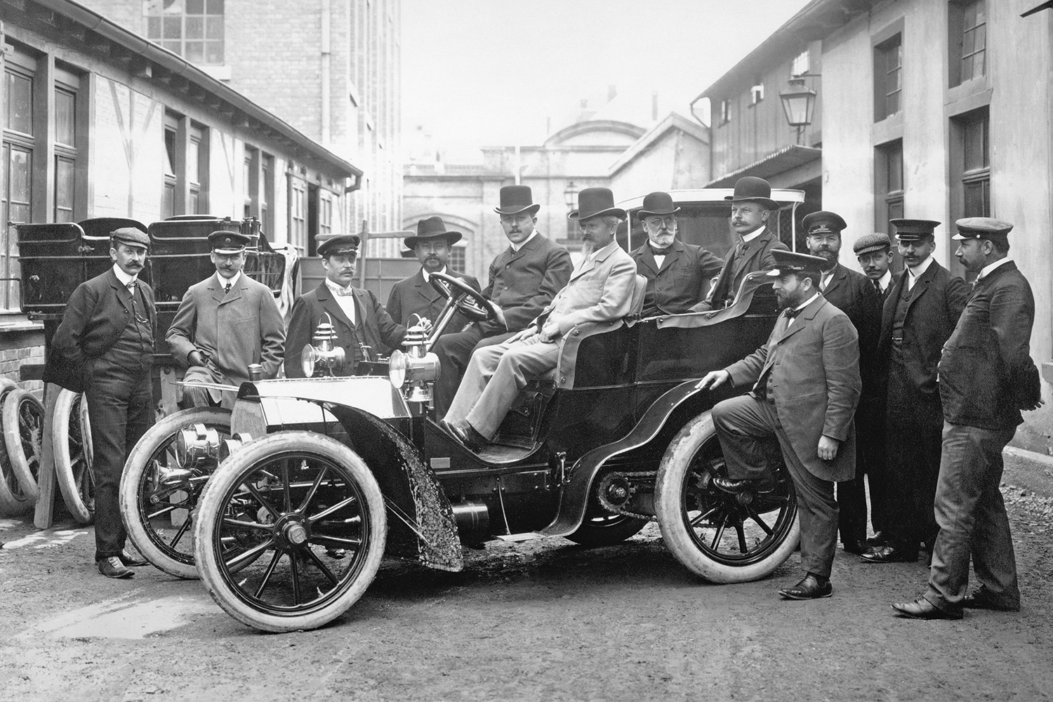 A black and white 1903 photograph of Wilhelm Maybach and Adolf Daimler