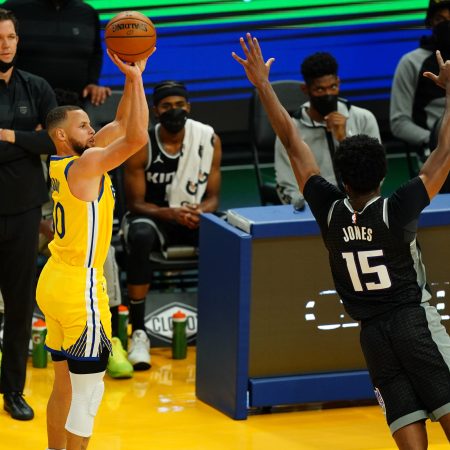 Stephen Curry of the Golden State Warriors shoots a three against the Sacramento Kings