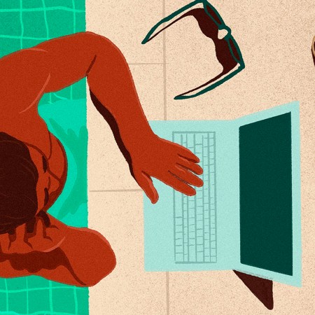 Man in a pool with his laptop