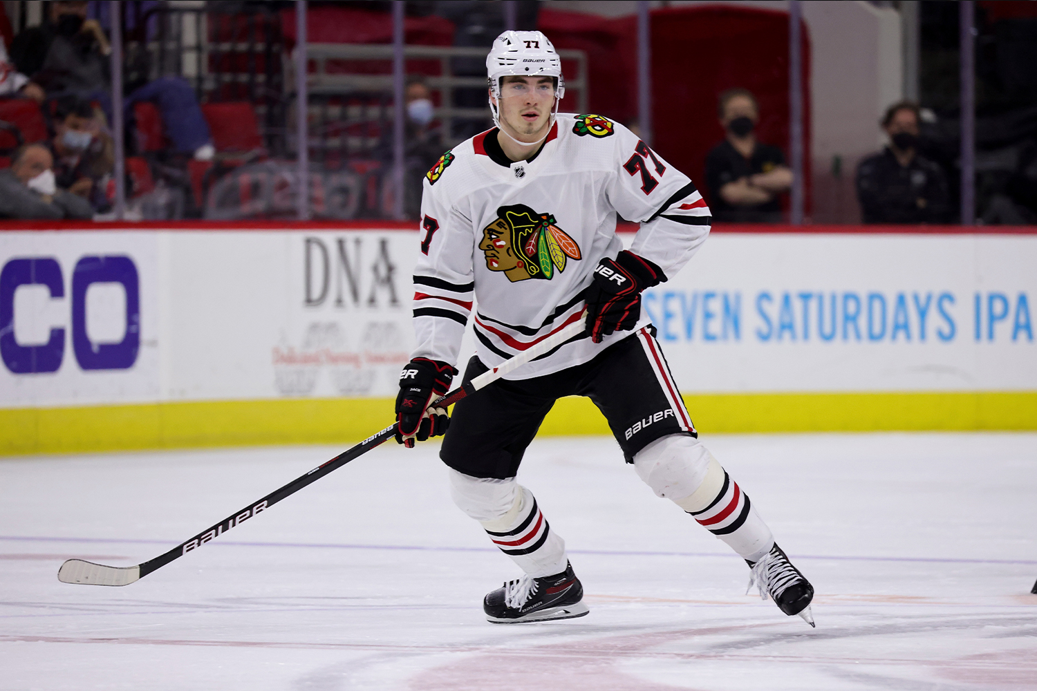 Kirby Dach #77 of the Chicago Blackhawks skates for position on the ice during an NHL game against the Carolina Hurricanes on May 3, 2021