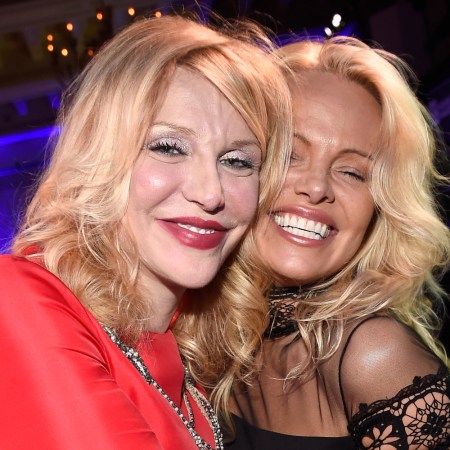 Courtney Love and Pamela Anderson embrace
