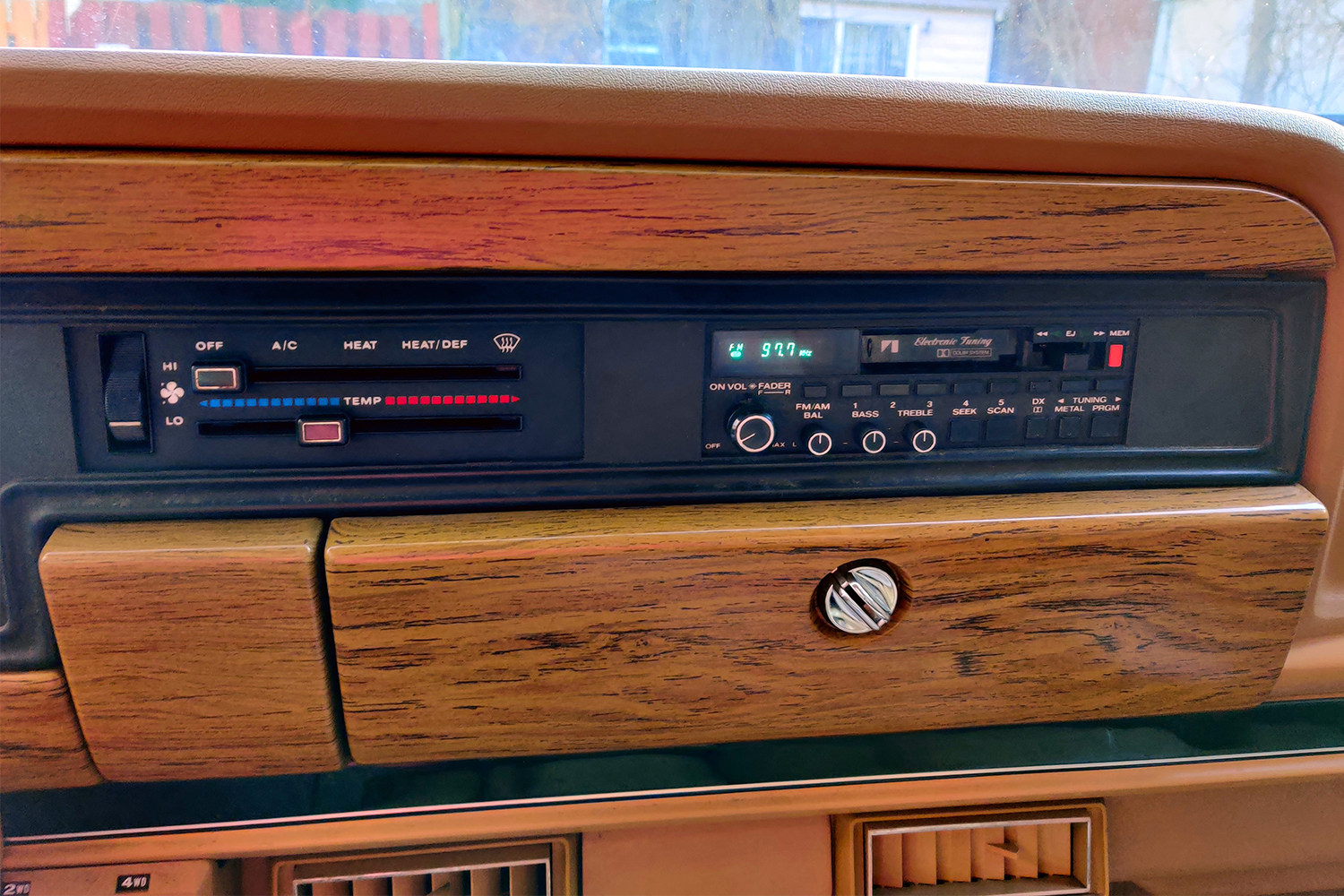 The period-correct tape deck of a 1987 Jeep Grand Wagoneer