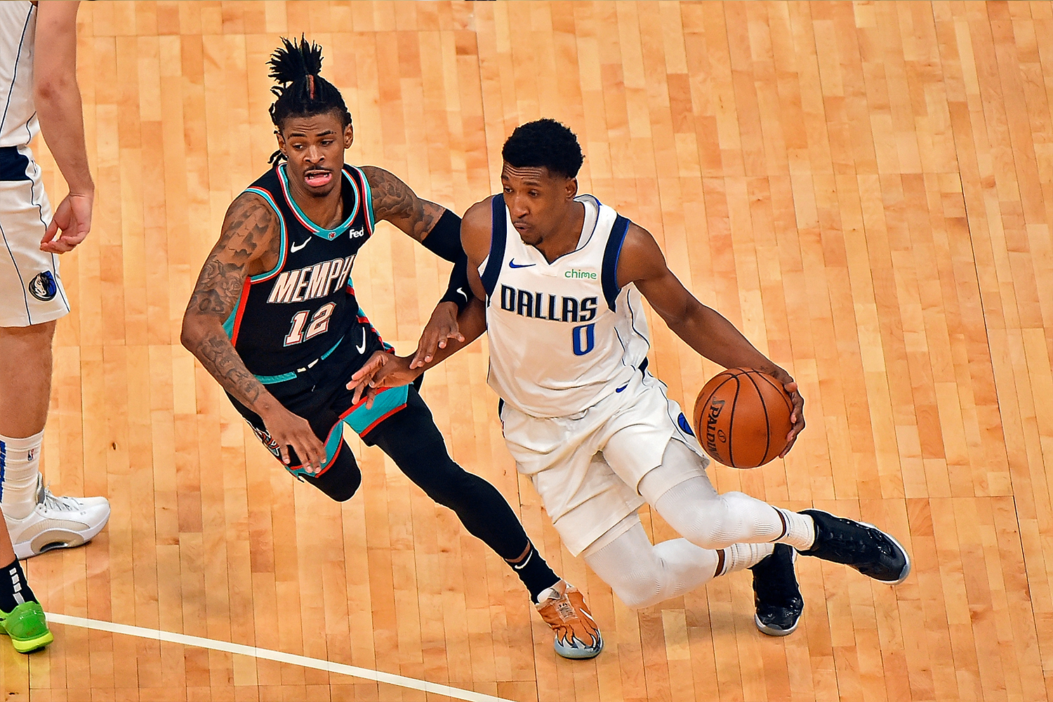 Josh Richardson #0 of the Dallas Mavericks handles the ball against Ja Morant #12 of the Memphis Grizzlies