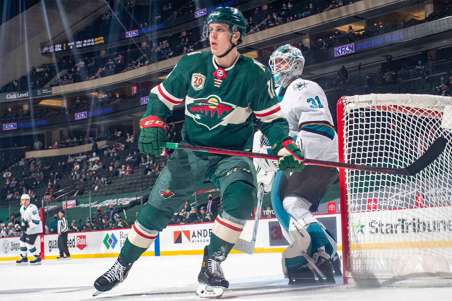 Martin Jones #31 of the San Jose Sharks defends against Joel Eriksson Ek #14 of the Minnesota Wild during the game at the Xcel Energy Center on April 17, 2021