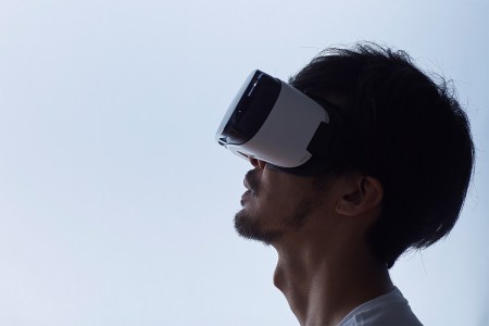 A man wearing a virtual reality headset. Could VR help with curing PTSD?