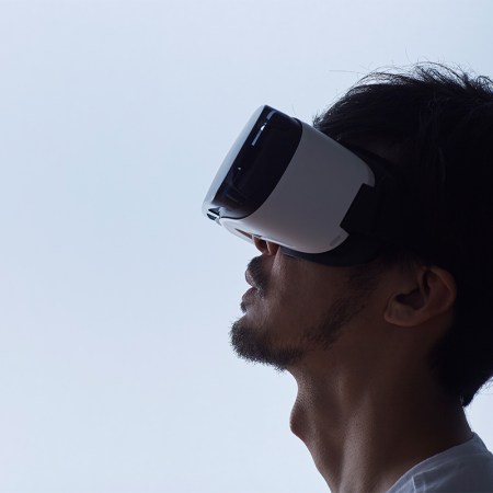 A man wearing a virtual reality headset. Could VR help with curing PTSD?