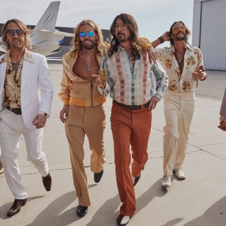 Foo Fighters dressed as their covers counterparts the Dee Gees