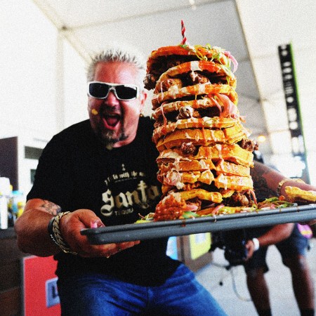 Guy Fieri doing his take on chicken and waffles at the South Beach Wine and Food Festival