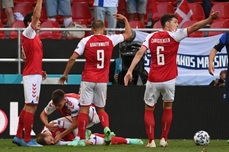Players help Denmark midfielder Christian Eriksen