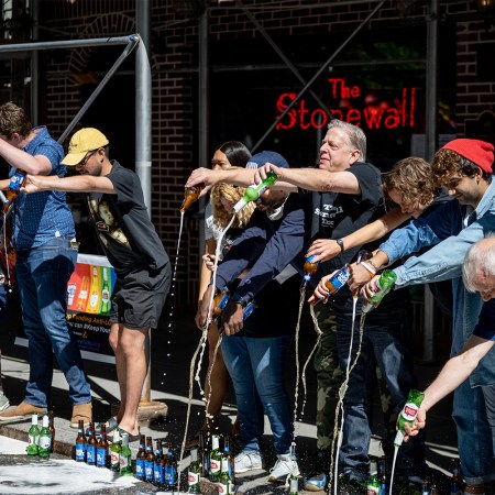 Protesters spill beer on the road as the Stonewall Inn protests Anheuser-Busch political donations to anti-trans bills lawmakers at Stonewall Inn on June 23, 2021 in New York City