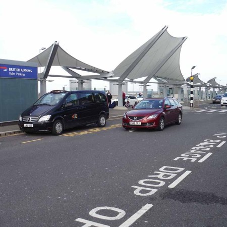 A drop off and a pick up point at Heathrow's Terminal 5. Drop-offs will now cost an extra fee.