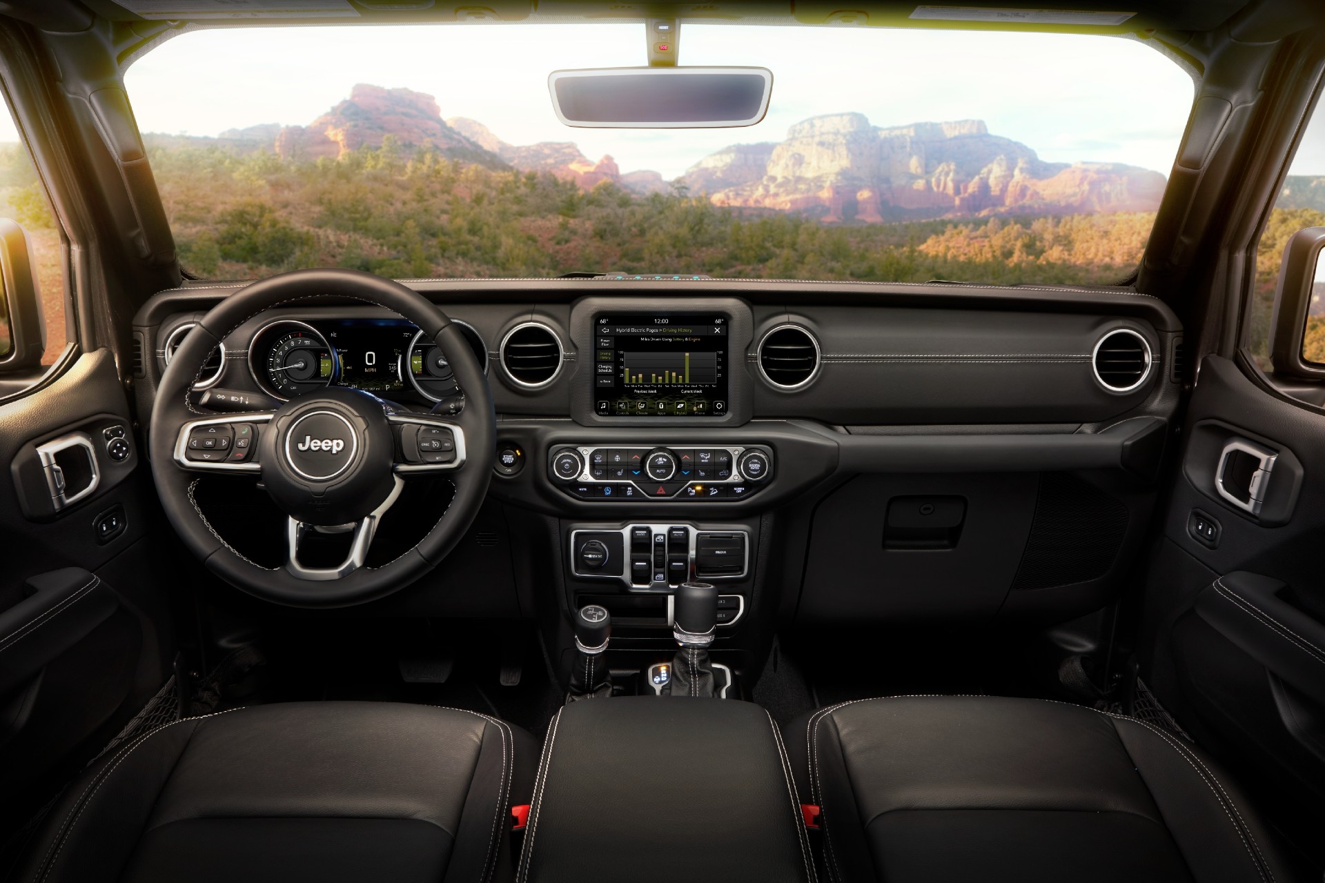 A view from the inside of a Jeep Wrangler looking out through the Gorilla Glass windshield