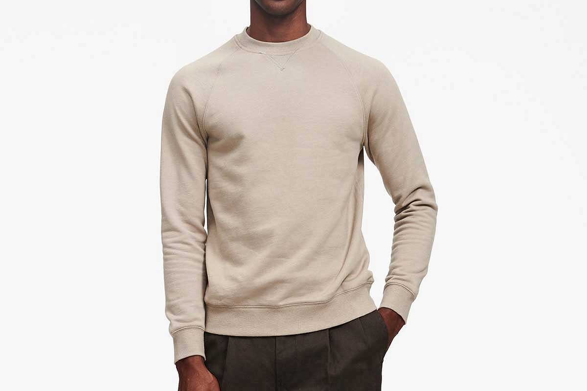 Sage green fleece sweatshirt on a man, via Naadam (now on sale)
