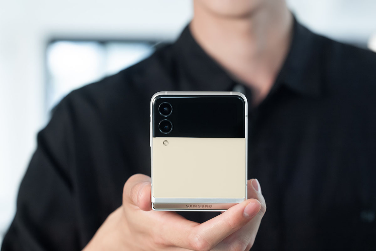 man holding a folded Samsung Z Flip3