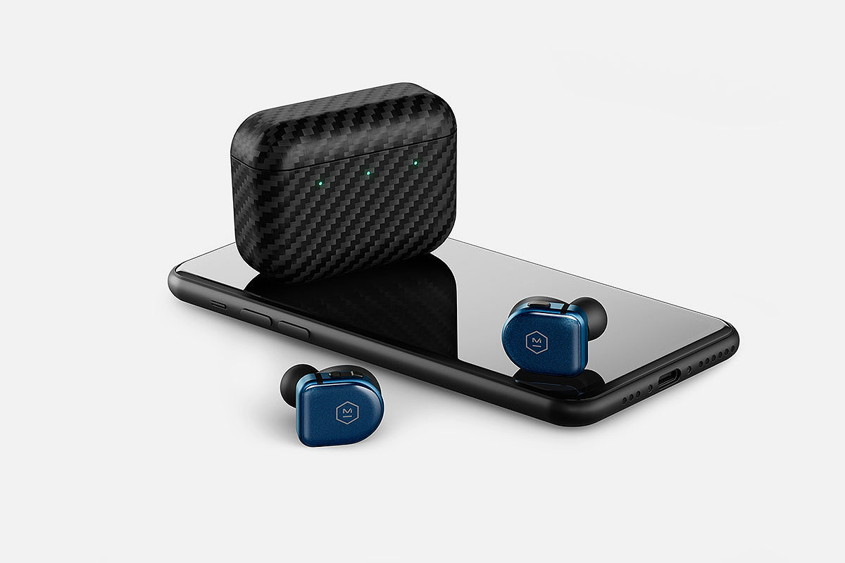 MW08 earbuds sitting on an iPhone