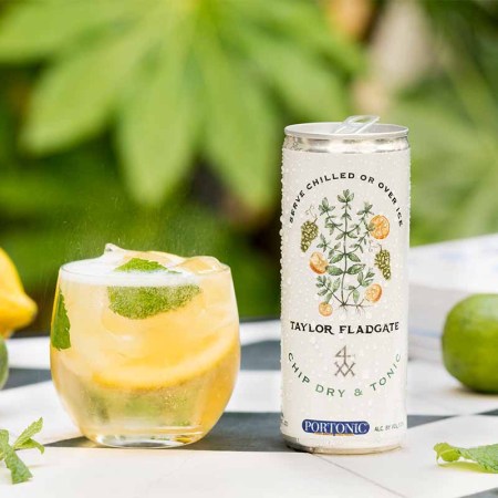 Taylor Fladgate Chip Dry & Tonic in a can, poured into a glass with mint and ice