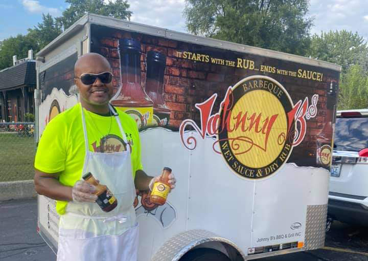 John Perkins in front of his food truck, Johnny B's