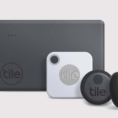 Three different sizes of Tile's Bluetooth trackers, from large rectangular ones to small circular trackers