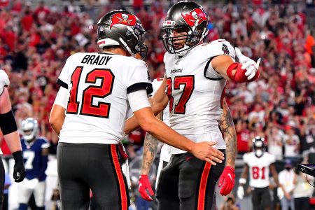Tom Brady and Rob Gronkowski of the Buccaneers celebrate a touchdown against the Dallas Cowboys at the beginning of the 2021-2022 season