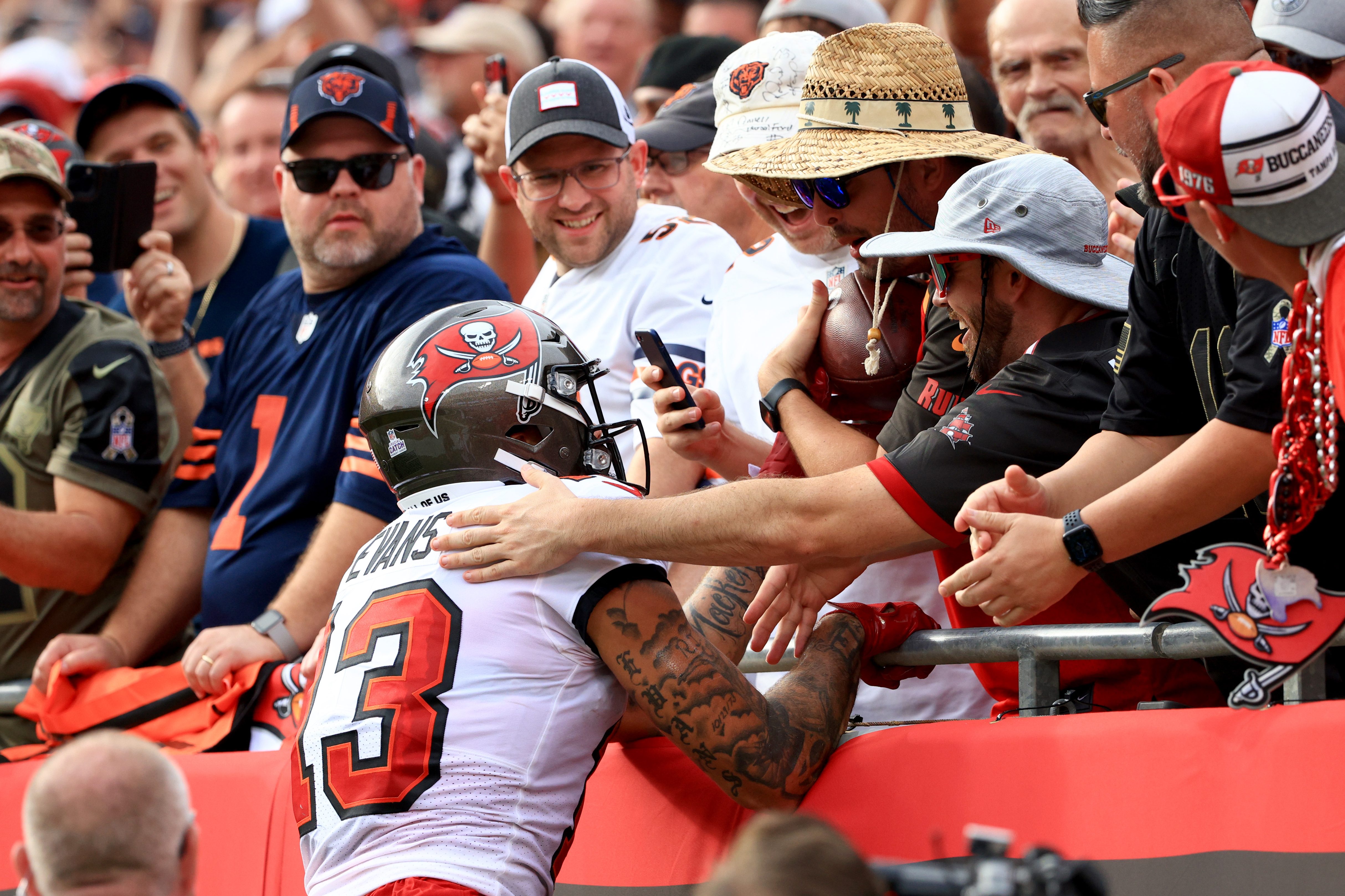 Mike Evans of the Tampa Bay Buccaneers celebrates with fans after scoring a touchdown