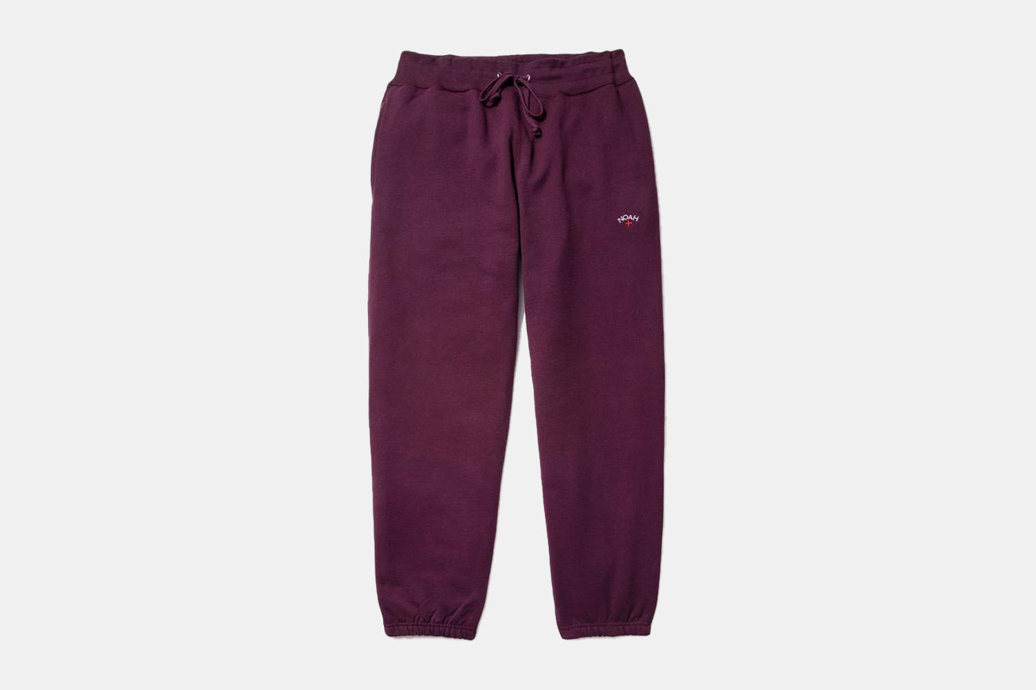 a pair of plum colored sweatpants