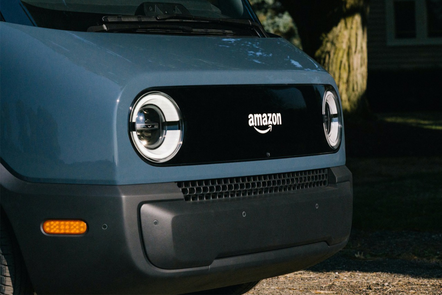 The front end of an electric Amazon delivery van built by EV startup Rivian. The so-called Rivian Prime Vans will reportedly hit the streets in 2021 after testing.