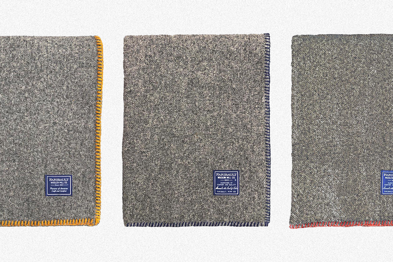 Three Bonfire Wool Throw Blankets from Faribault Woolen Mill, one with gold whip stitching, one with charcoal and one with red