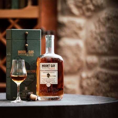 Mount Gay Master Blender Collection Andean Oak Cask, with a glass of rum. The rum is new and limited edition.