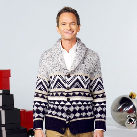 neil patrick harris surrounded by gift boxes wearing a cozy cardigan