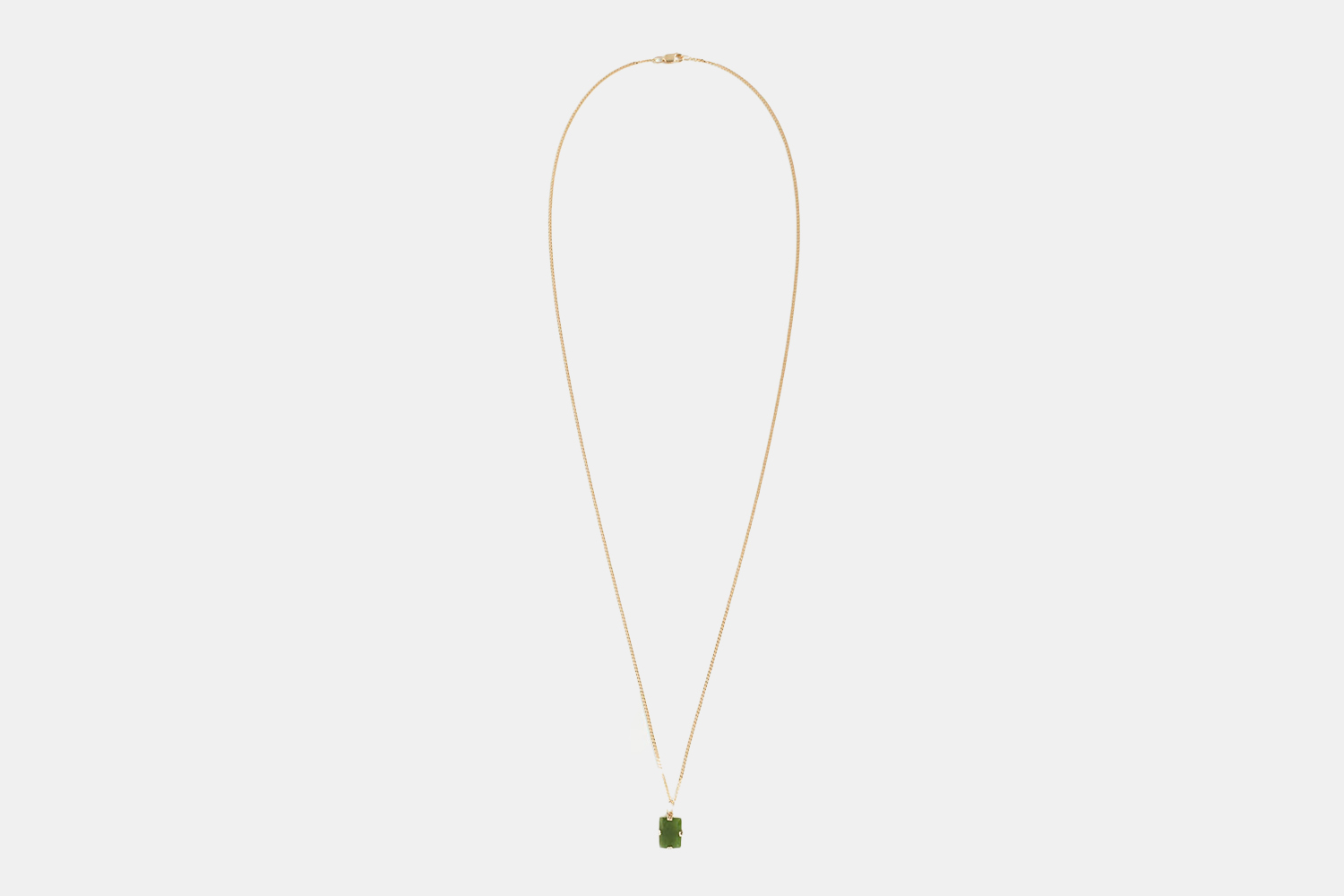 a gold chain with a stone