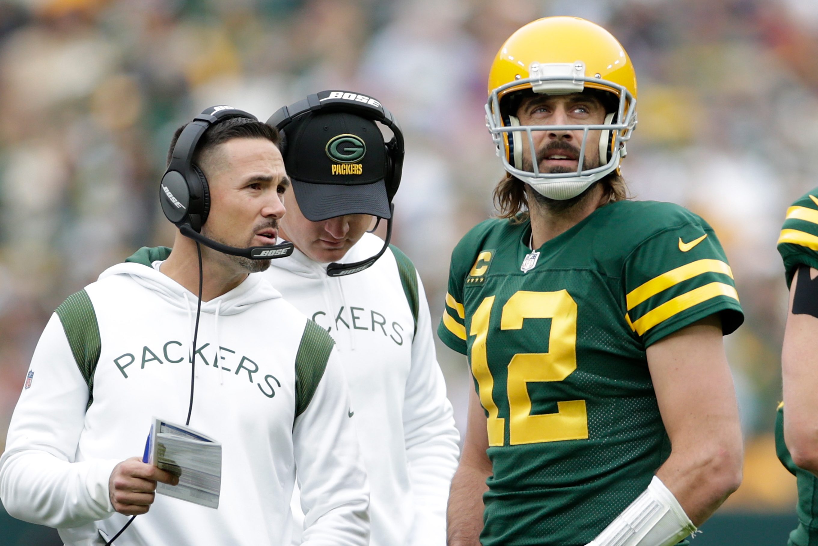 Aaron Rodgers talks with Green Bay Packers head coach Matt LaFleur during a game