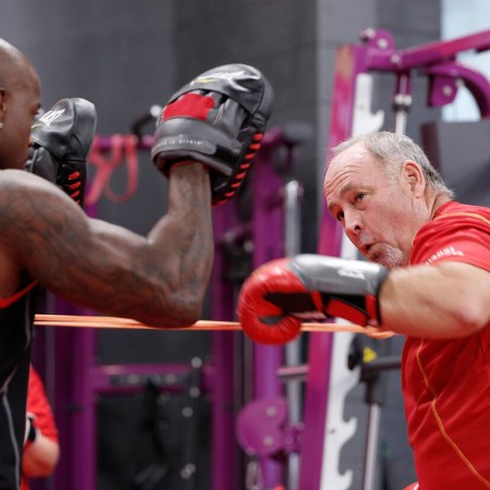 A man sparring with his trainer in "The Biggest Loser."