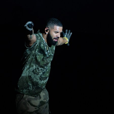 Drake performing against a black background. An anecdotal study revealed that listening to Drake makes runners run slower.