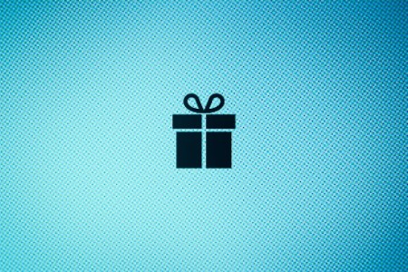 A present icon in the middle of a blue background