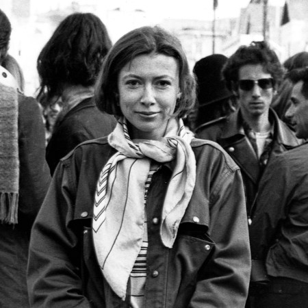 Joan Didion stands at the panhandle of Golden Gate Park with a group of hippies during the writing of her article "Slouching Towards Bethlehem" in April 1967.