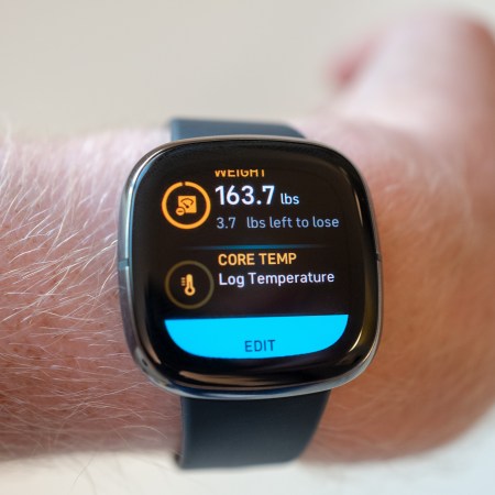 A close-up of fitness tracking watch that says "3.7 pounds left to lose."