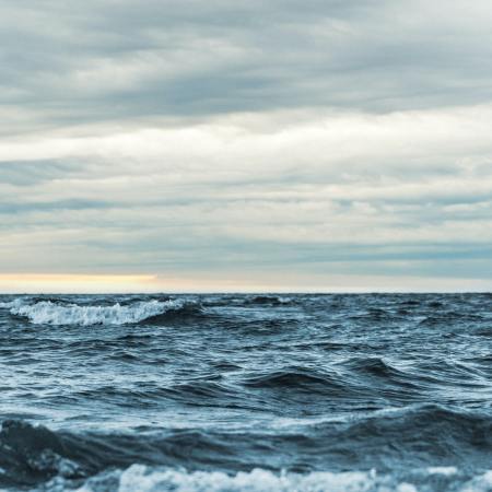 Whitecaps on the ocean under a cloudy sky. The National Academy of Sciences is studying ways of geoengineering the oceans to thwart climate change.