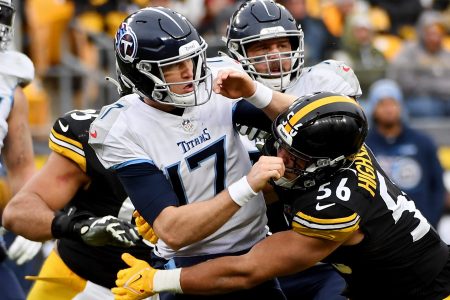 Ryan Tannehill of the Titans is tackled by Alex Highsmith of the Steelers