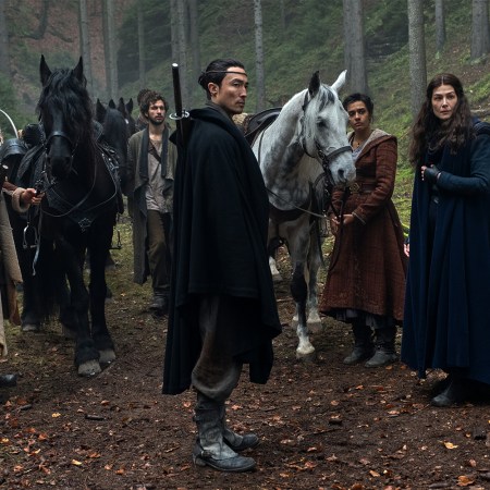 The main characters in the "Wheel of Time" Prime Video series, including Lan, Moiraine, Egwene, Mat and Rand, all standing in the forest in episode two of season one