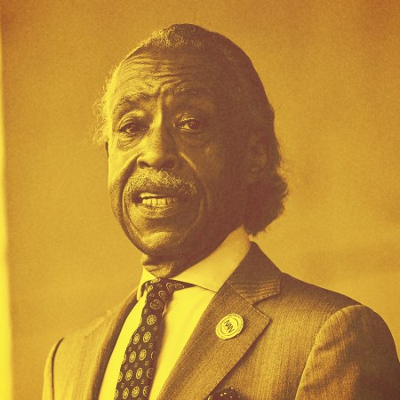 Al Sharpton in a noch lapel jacket and tie