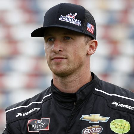 Brandon Brown walks the grid prior to the NASCAR Xfinity Series Drive for the Cure 250. NASCAR nixed the driver's “Let’s Go, Brandon” cryptocurrency sponsorship deal