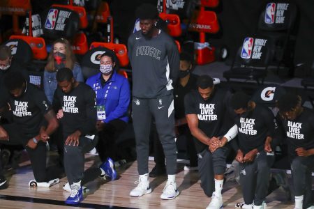 Jonathan Isaac stands during the national anthem before an NBA game. Isaac is releasing a new book through Ben Shapiro's publishing house.