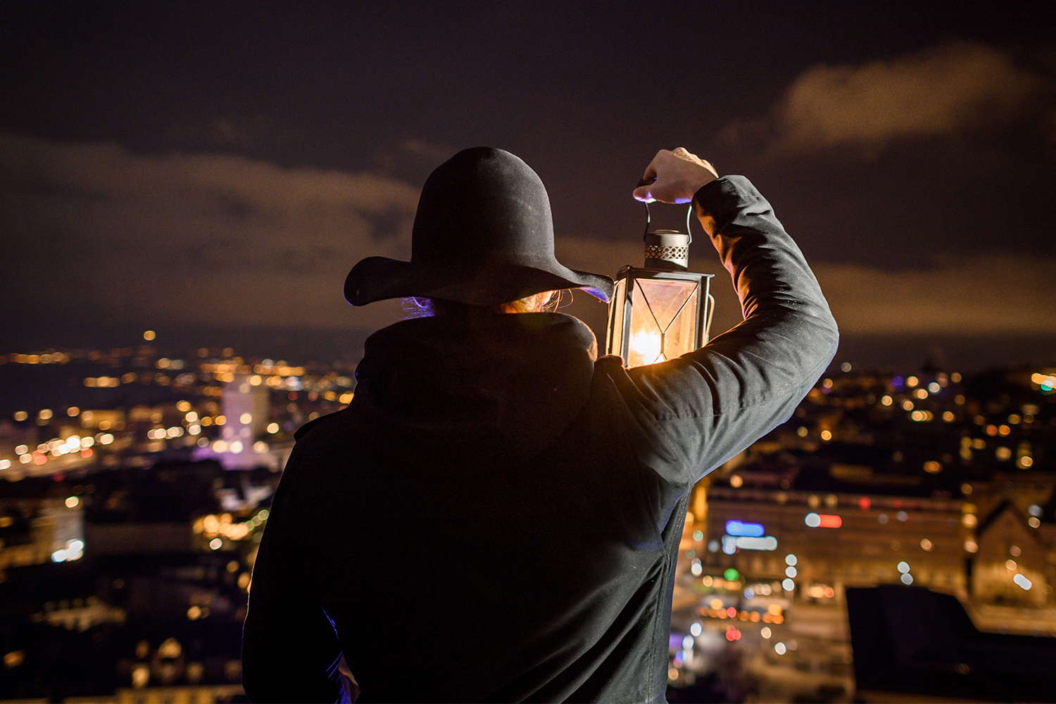 Nightwatchman Marco Carrara looking out from the Lausanne Cathedral bell tower in December 2018. The night watch hired the first woman in 600 years: Cassandre Berdoz.