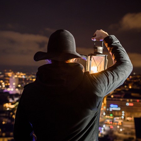 Nightwatchman Marco Carrara looking out from the Lausanne Cathedral bell tower in December 2018. The night watch hired the first woman in 600 years: Cassandre Berdoz.