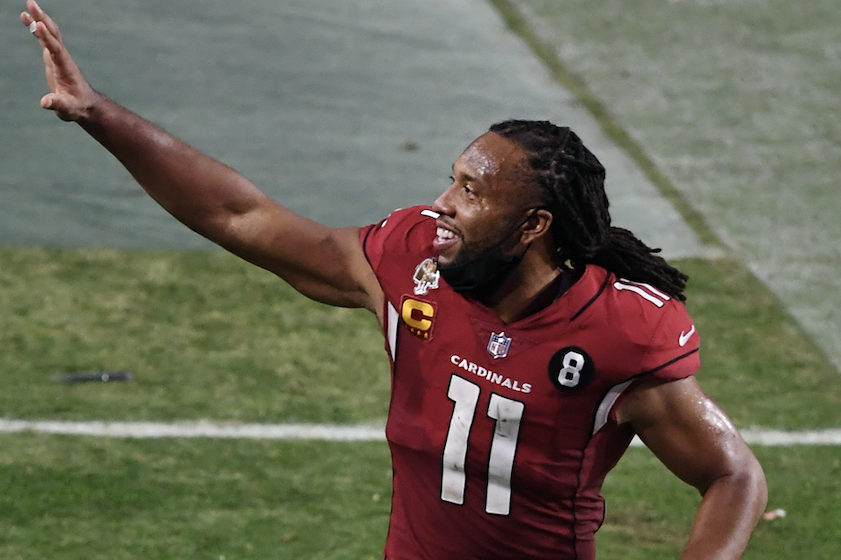 Wide receiver Larry waves to fans at State Farm Stadium in 2020
