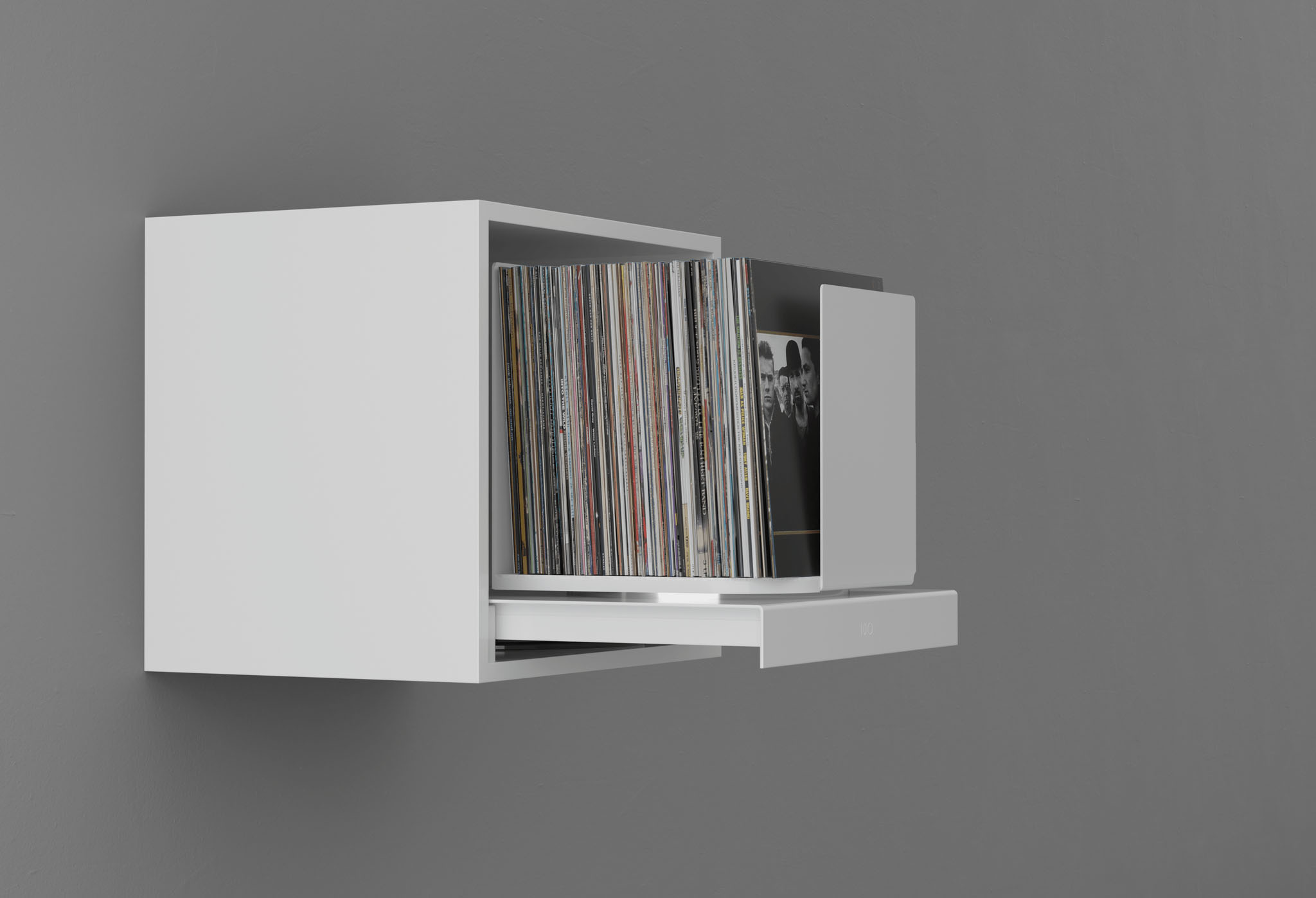 a white self with a record holding extension