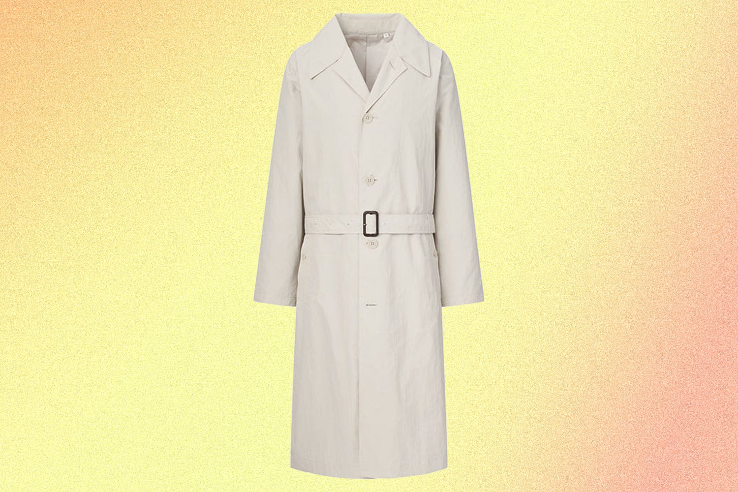 a cream colored tench coat on a yellow background