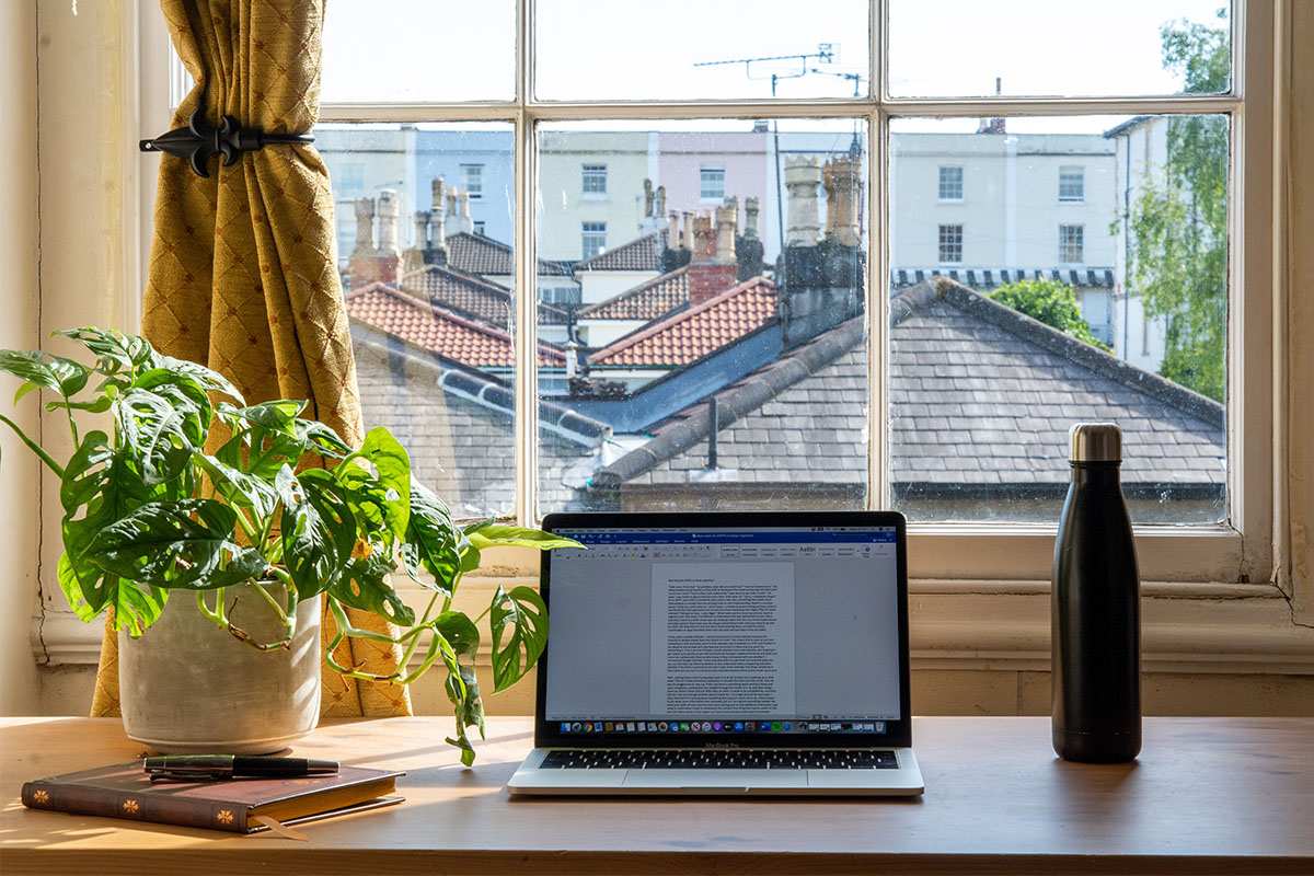 A desk facing a window.