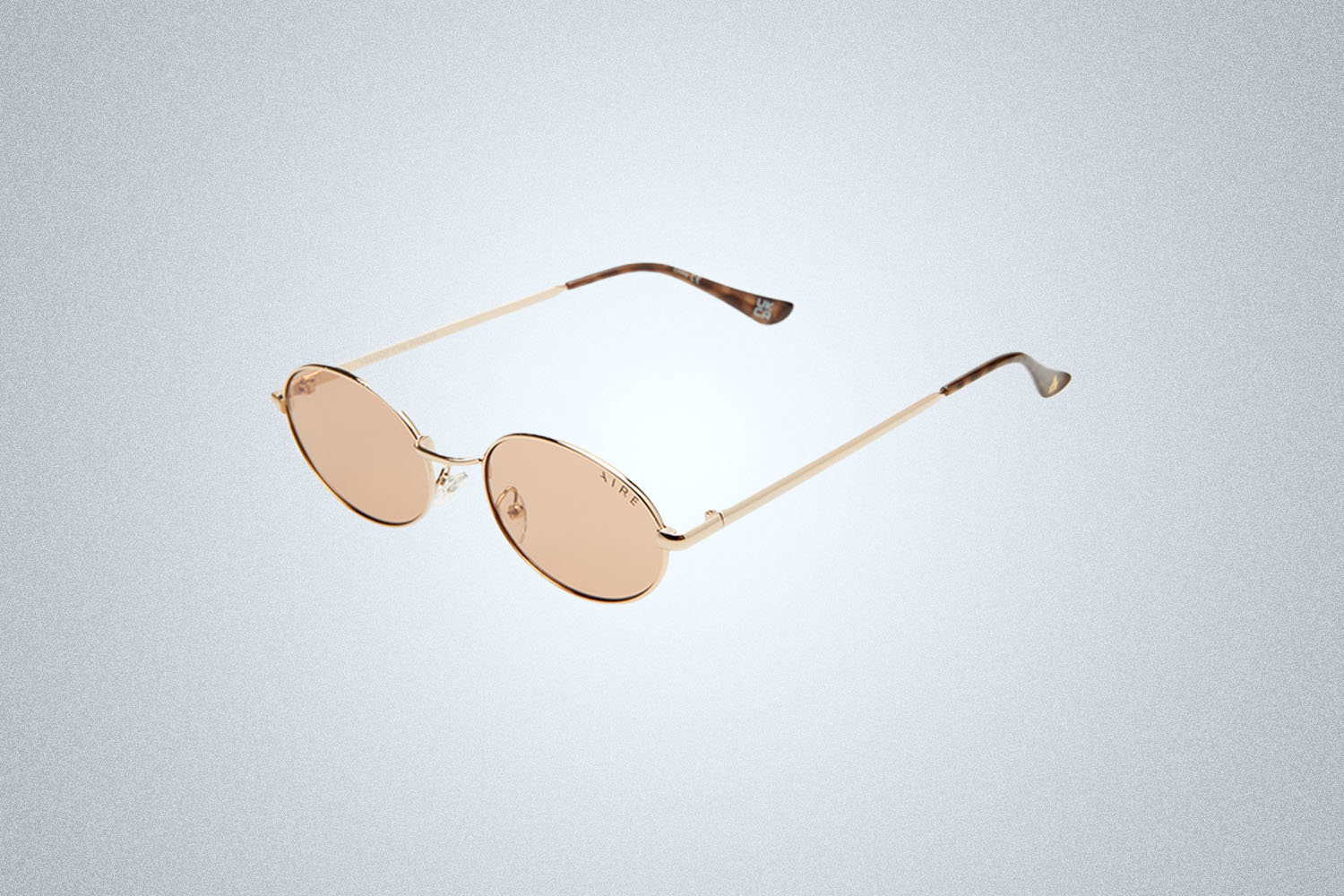 a pair of sunglasses on a grey background