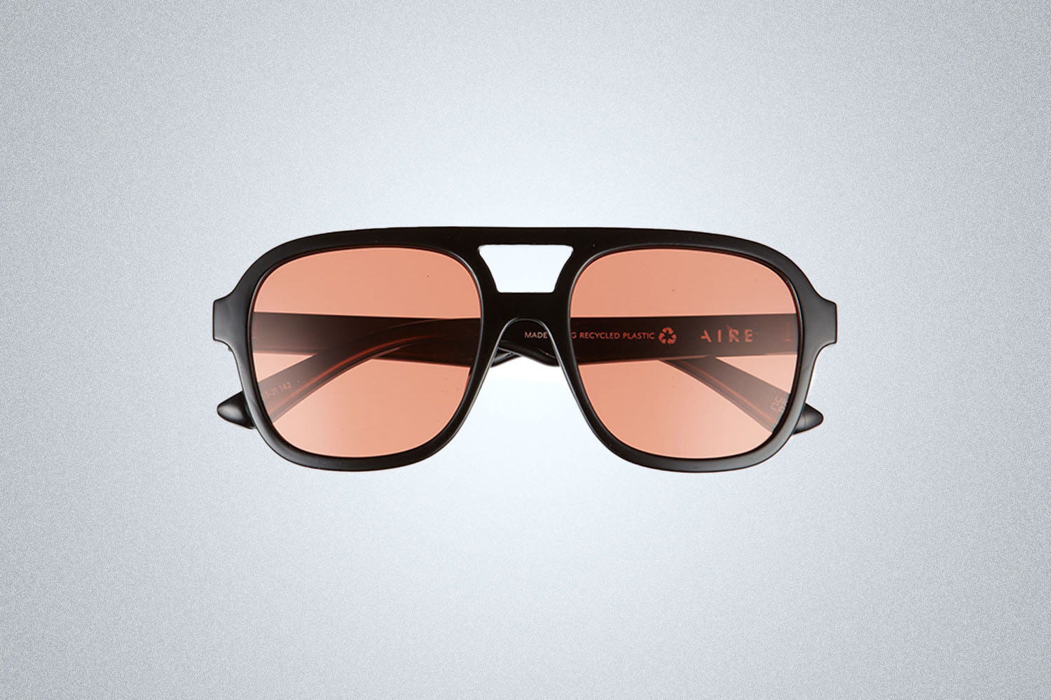 a pair of sunglasses on a grey background